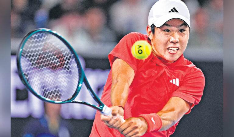 Learner Tien of the US plays a backhand return to Daniil Medvedev of Russia during their second round match at the Australian Open in Melbourne, on Thursday. Photo: AP