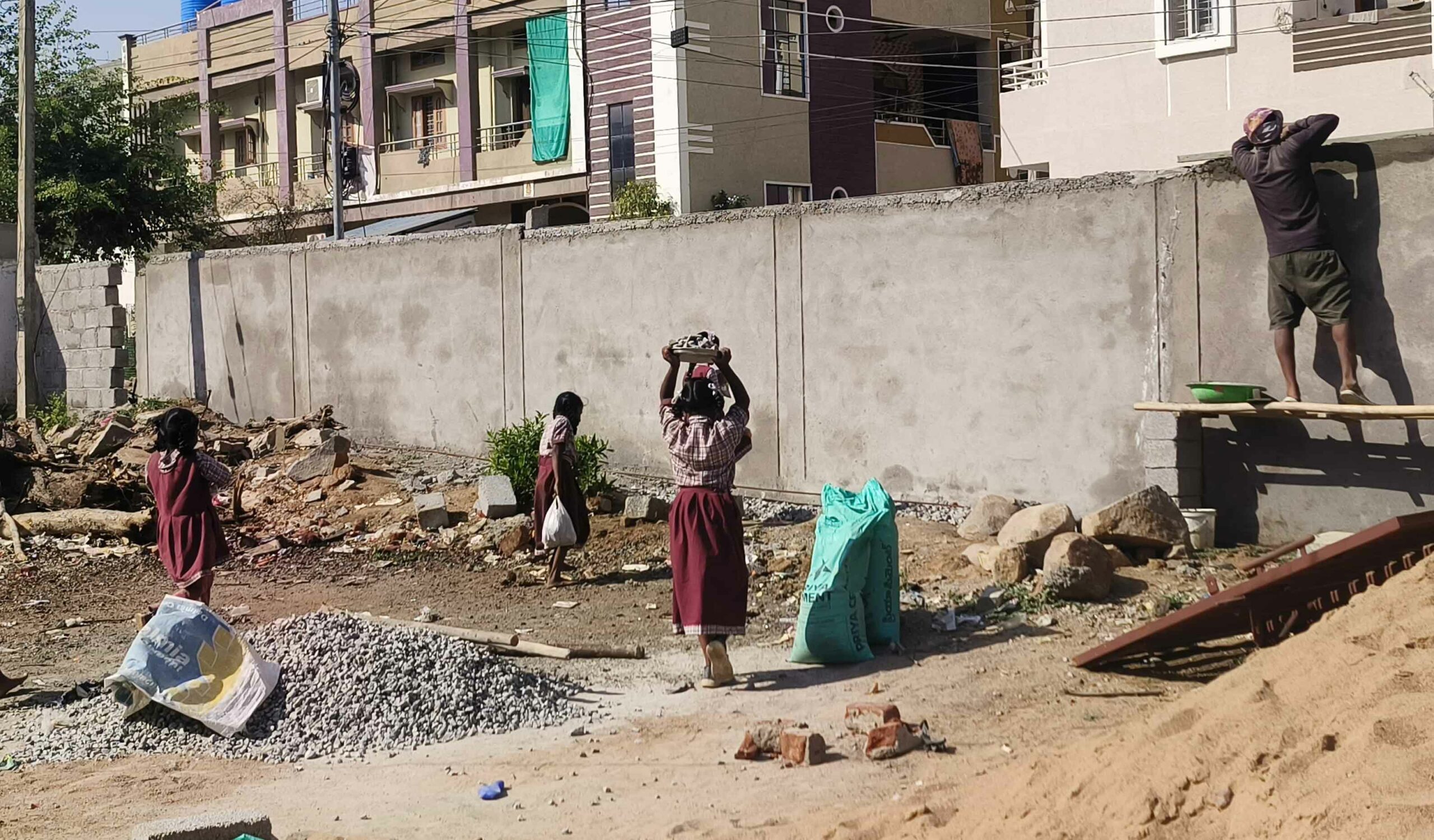 Teachers make primary school students carry gravel in mid-day meal plates in Sangareddy