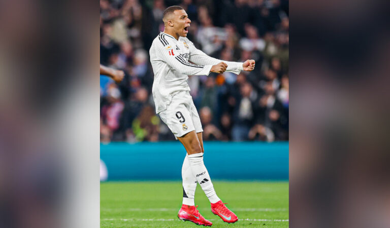 Real Madrid's Kylian Mbappé celebrates after scoring a goal against Atletico Madrid during the La Liga match.