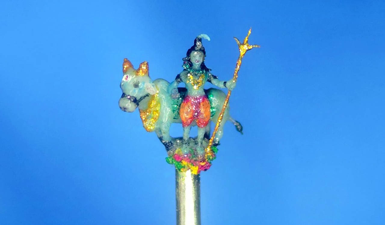 Jagtial micro artist carves Lord Shiva, Nandi on needle