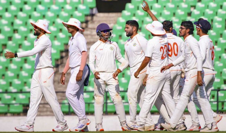 Vidarbha’s Parth Rekhade celebrates with teammates after taking the wicket of Mumbai’s Suryakumar Yadav during the second day of a Ranji Trophy semifinal match, at VCA stadium in Nagpur, on Tuesday. Photo: PTI