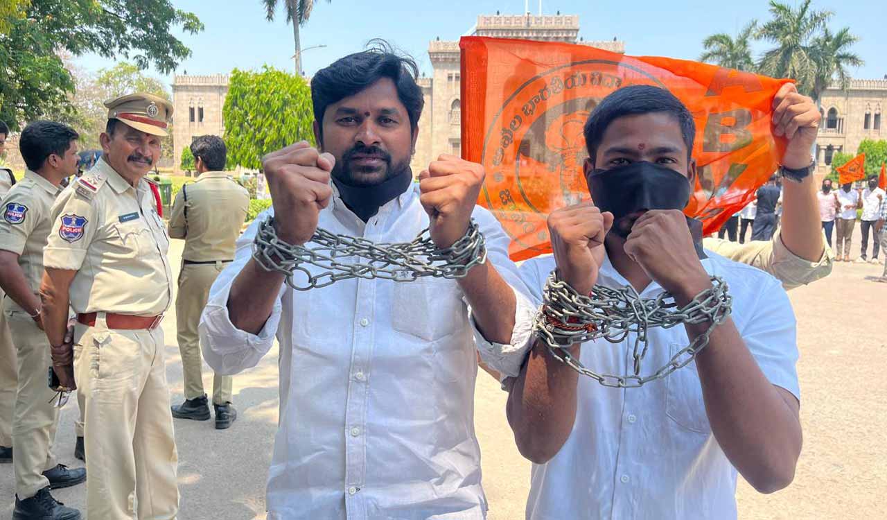 Hyderabad: ABVP activists protest with black ribbons over mouths and handcuffs on Osmania University campus