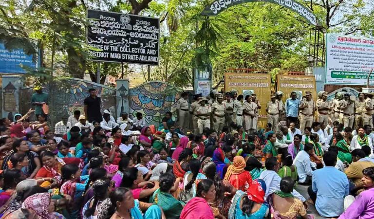 Tribal women stage a sit-in in front of Collectorate demanding basic amenities and electric metres in Adilabad on Saturday.
