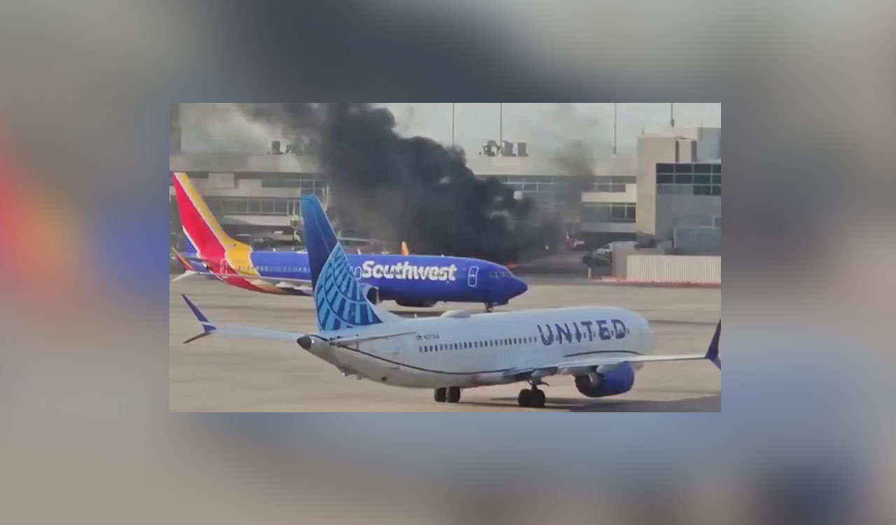 American Airlines plane catches fire at Denver airport gate