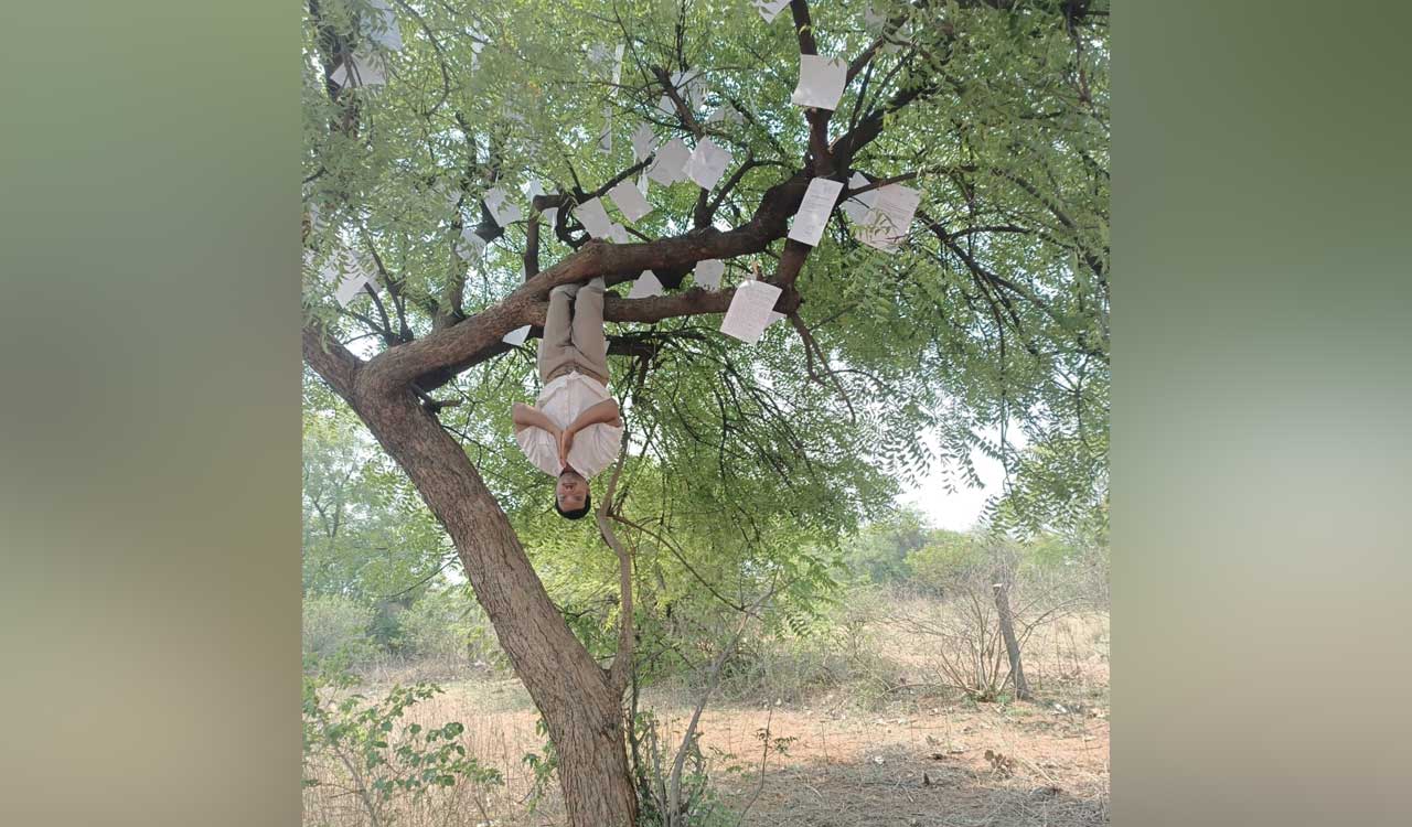Farmer suspends himself upside down on tree in protest against official apathy in Hyderabad