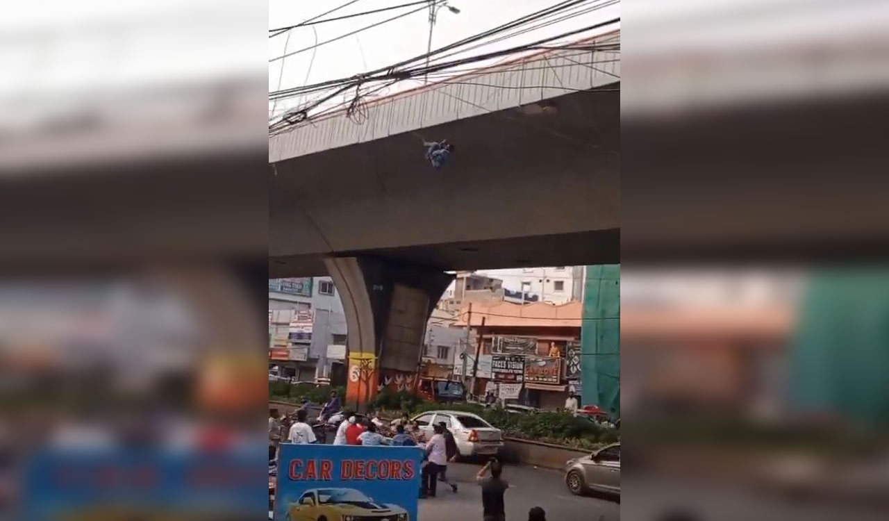 Watch: Lucky escape for drunk man dangling from wires on PVNR Expressway in Hyderabad