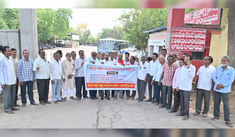 TGRTC retired employees display a banner of demands in Mancherial.