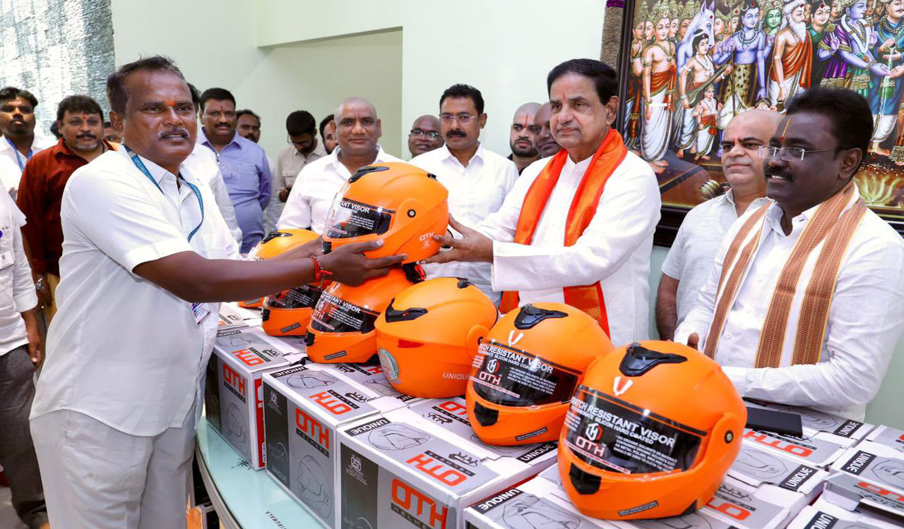 TTD Chairman BR Naidu distributes helmets to employees