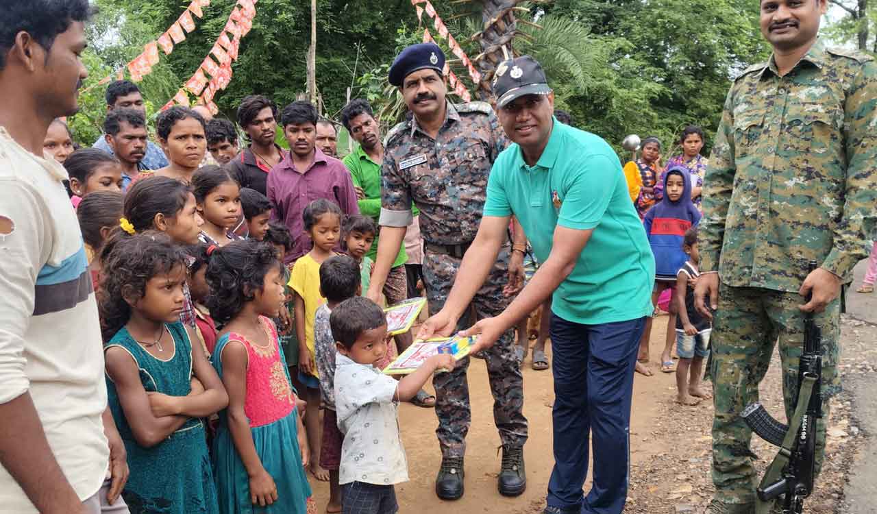 Senior police officers distribute books and blankets in Kothagudem’s tribal village
