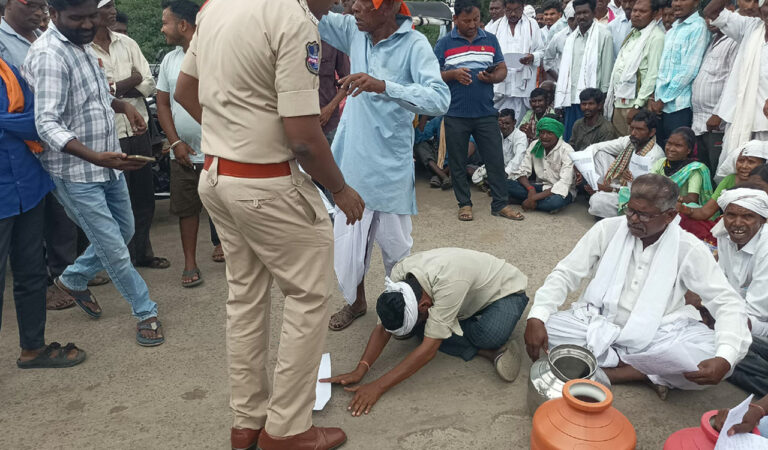 Tribals fall at feet of police personnel in desperation for drinking water in Telangana's Asifabad