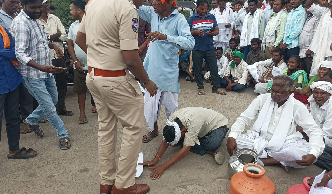Tribals fall at feet of police personnel in desperation for drinking water in Telangana’s Asifabad