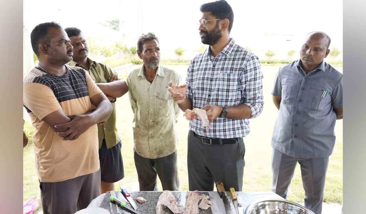 Kothagudem Collector gives demo on boneless fish cutting method to fishermen
