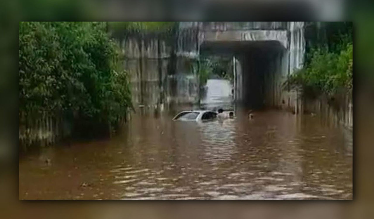 Agriculture officer’s car submerges in floodwaters, rescued by locals in Khammam