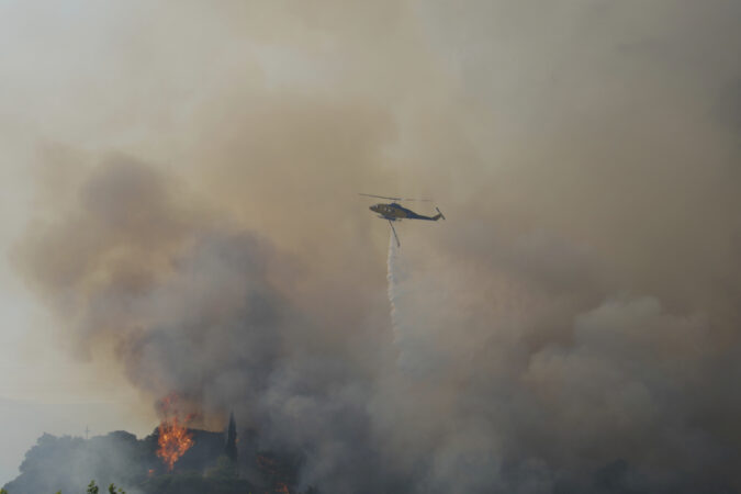 Wildfires rage across southern Europe, killing at least three