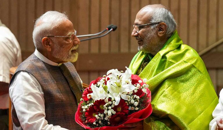 Prime Minister Narendra Modi felicitates Maharashtra Governor and NDA's vice presidential candidate C.P. Radhakrishnan during the NDA parliamentary party meeting, in New Delhi.