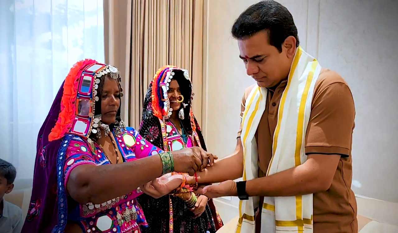 Tribal women tie Rakhi to KTR for his support in Lagacherla land struggle