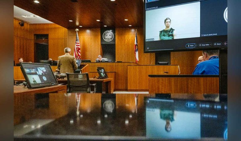 Defence attorney Greg Skordas, left, speaks before judge Tony Graf, back center left, as Tyler Robinson, accused of fatally shooting Charlie Kirk, attends a virtual court hearing from prison in Provo, Utah.
