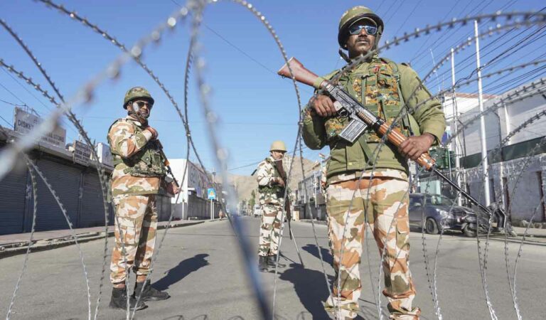 Security personnel stand guard during a curfew after recent protests for statehood turned violent leaving four people dead and 90 others injured, in Leh, Ladakh.