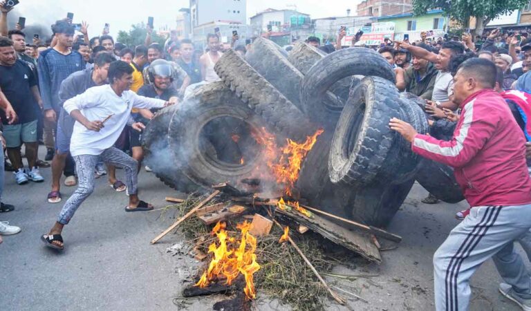 Protesters burn tires violating the curfew orders in Kathmandu, Nepal,