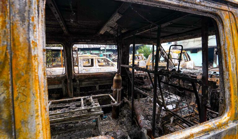 An ambulance lies charred after being set ablaze during anti-government protests, in Birgunj, Parsa District, Nepal.