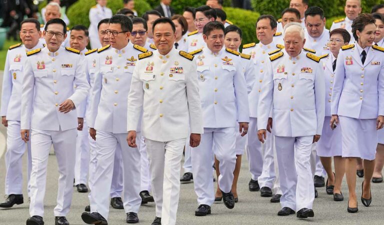 Thailand's Prime Minister Anutin Charnvirakul, center, with his cabinet members leaves from the government house in Bangkok.
