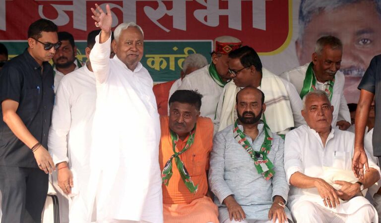 Bihar Chief Minister Nitish Kumar waves to the gathering during a public meeting in support of Janata Dal (United) candidate from Kanti constituency Ajit Kumar for the 2025 Bihar Assembly elections, in Muzaffarpur.