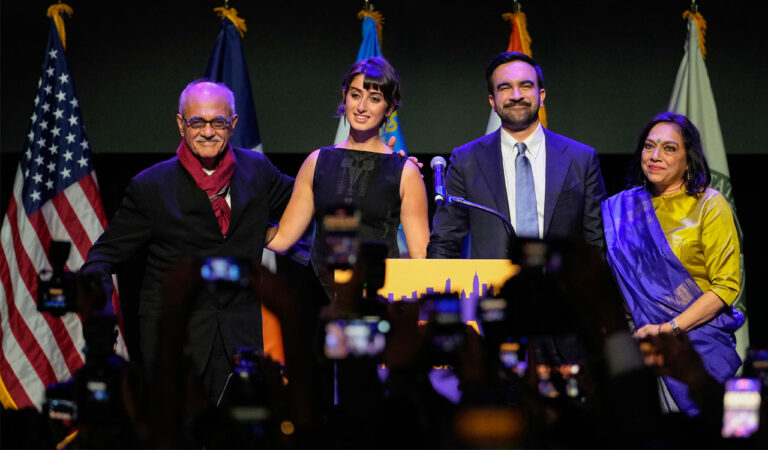 Mayor-elect Zohran Mamdani, second from right, stands on stage with his wife Rama Duwaji, second from left, and his father, Mahmood Mamdani, far left, and mother, Mira Nair, after making an acceptance speech.