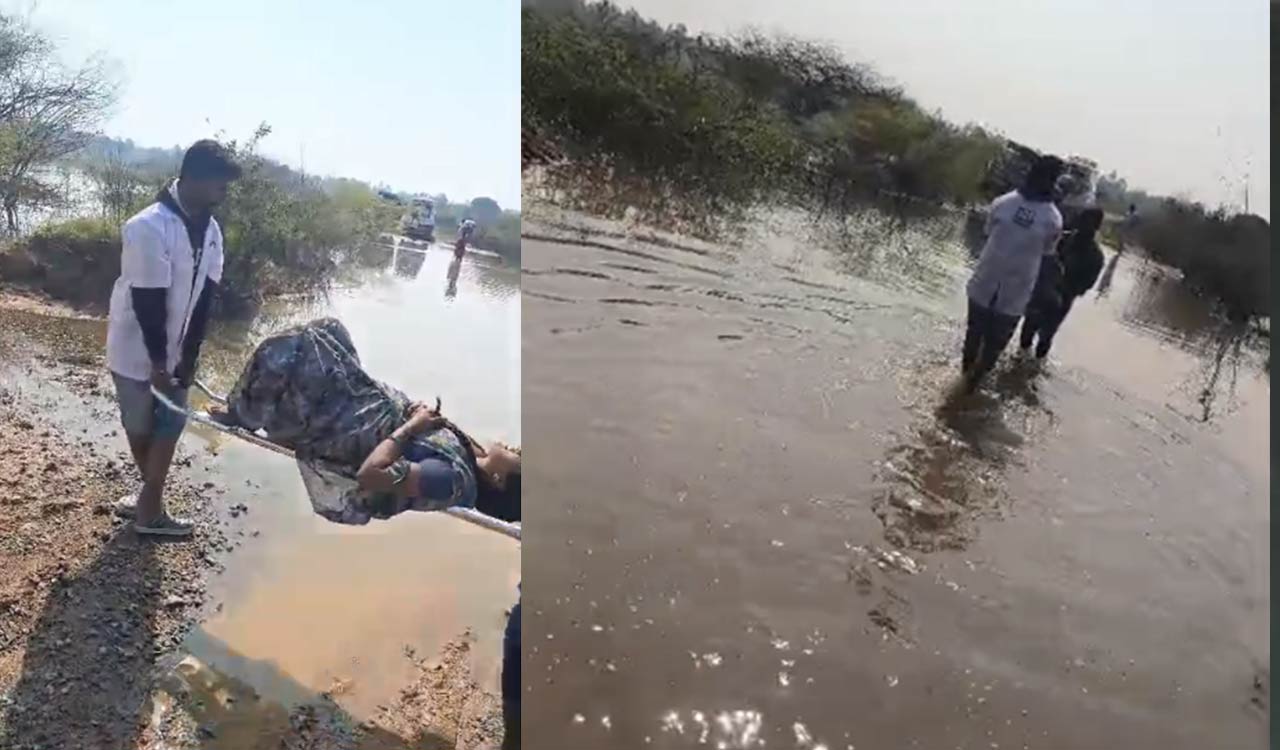 Watch: Ambulance staff carry pregnant woman across submerged road in Pulkal mandal