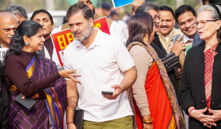 LoP in the Lok Sabha and Congress leader Rahul Gandhi with MP Kanimozhi Karunanidhi during a protest against Special Intensive Revision (SIR) at Parliament complex during Winter session, in New Delhi