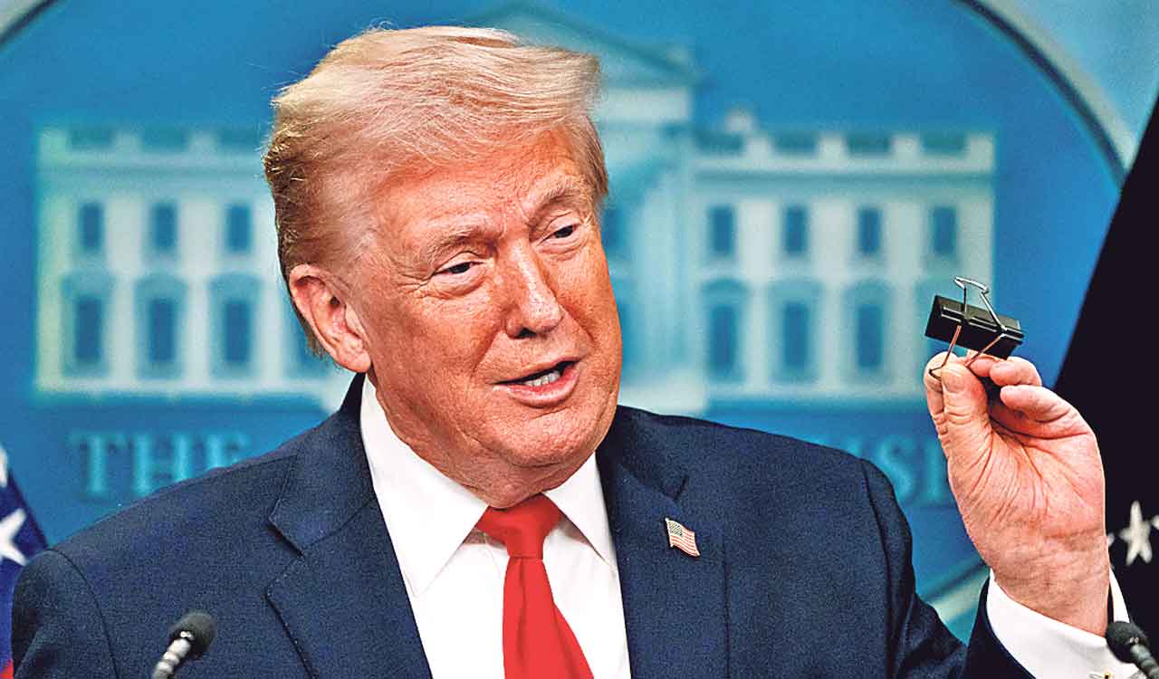 Trump recaps first year back in office with winding remarks, paper tossing and impressions