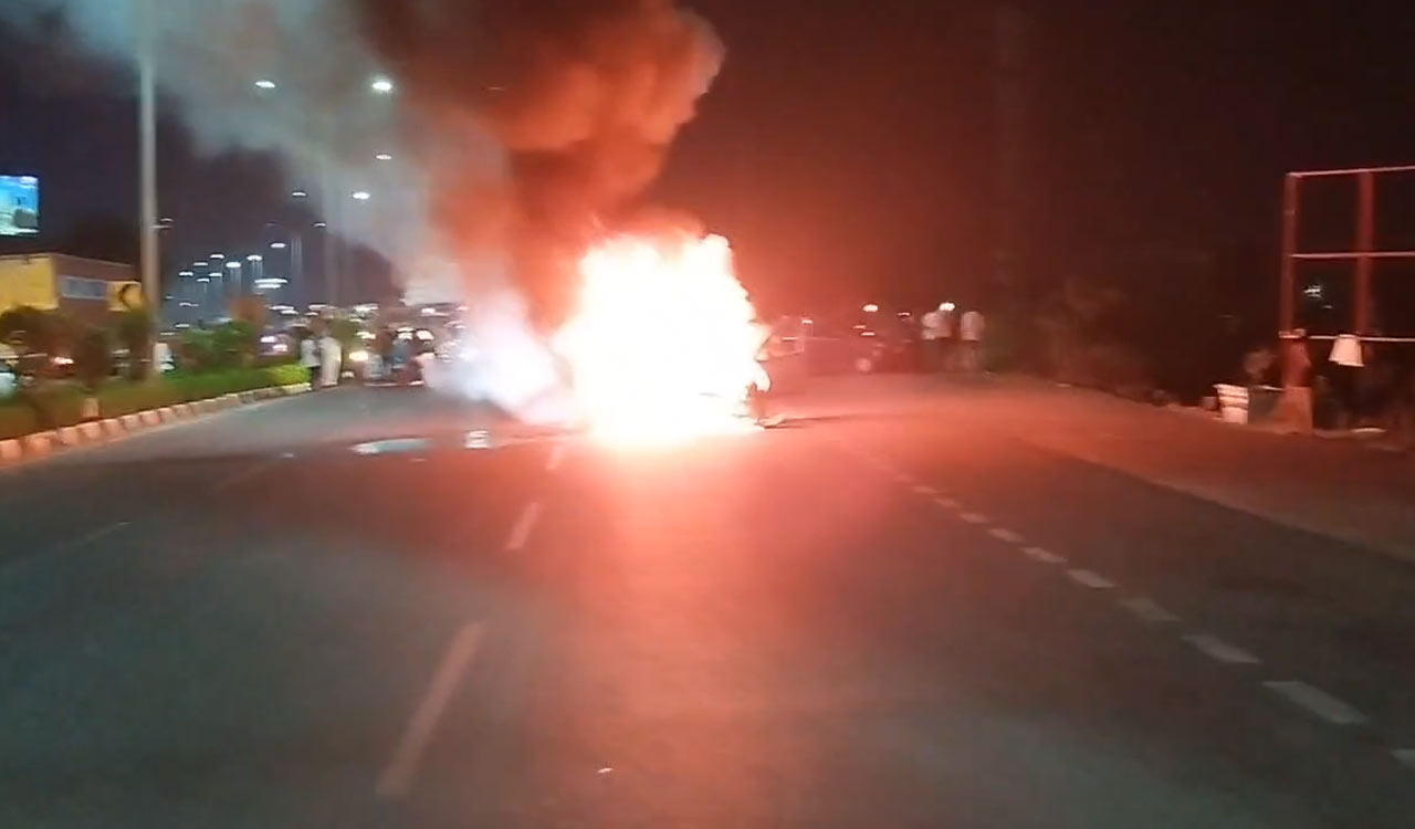 Watch: Moving car catches fire on Shamshabad road