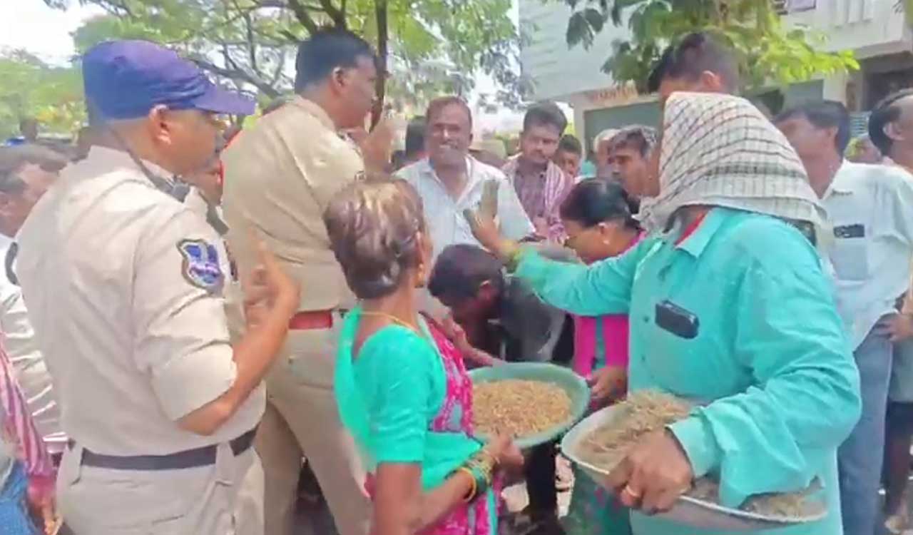 Procurement crisis: Farmer falls at the feet of police officer during a protest in Jangaon