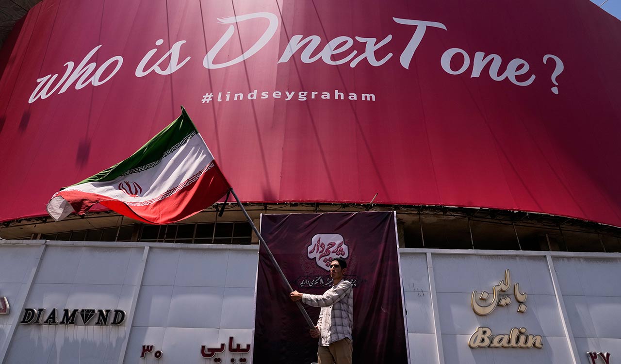 US strikes bridges and collapses a tower at a key port as its Iran campaign expands