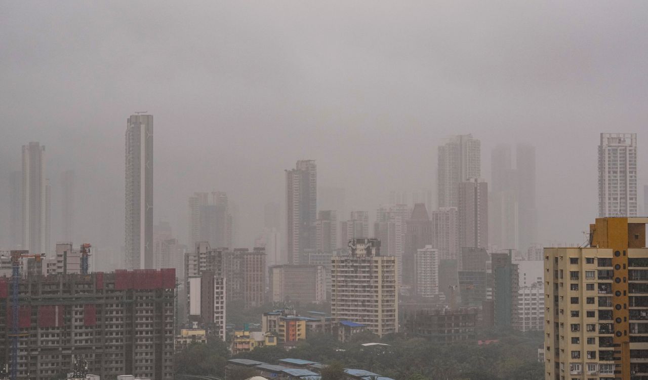Mumbai rains: IMD issues red alert as incessant downpour triggers road cave-ins, waterlogging, and traffic chaos
