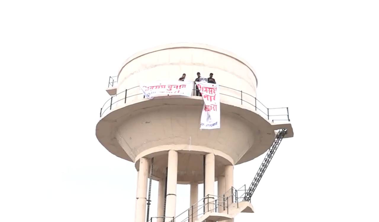 NSUI workers climb atop water tank in Jaipur, denounce police action at Jantar Mantar