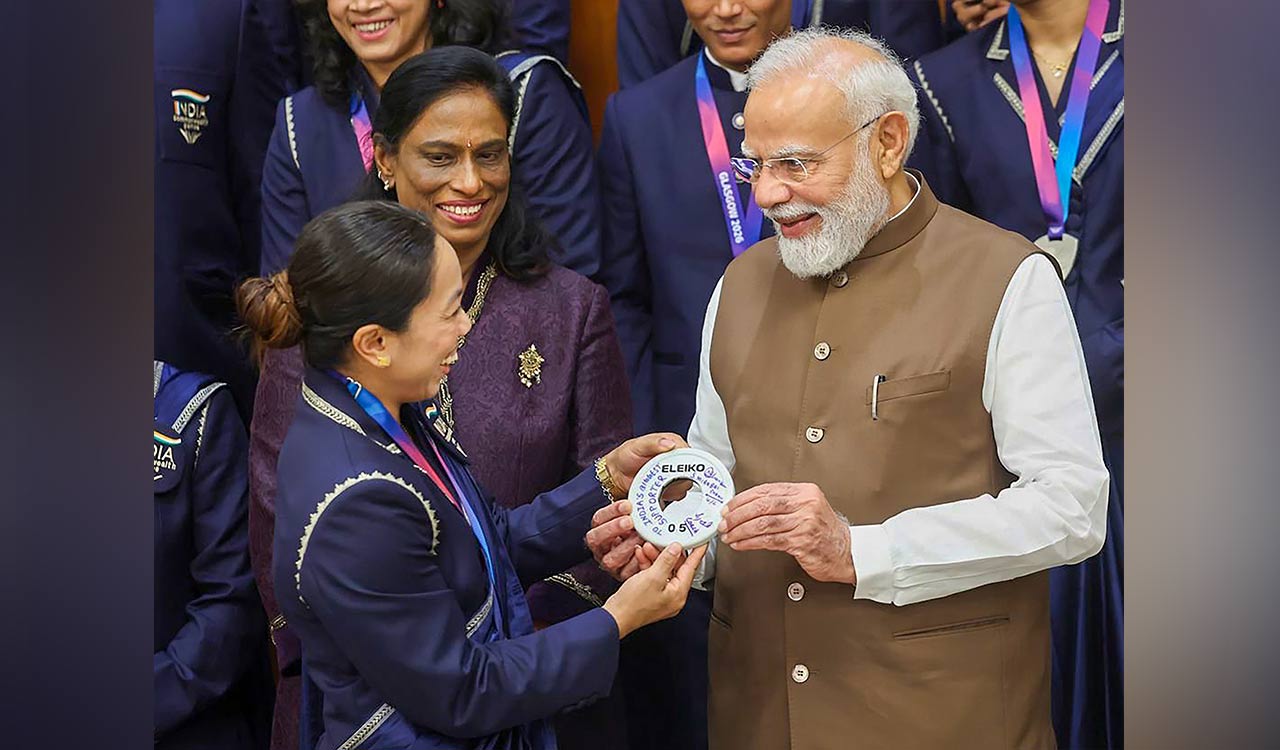 PM meets CWG medallists: Lauds Lovlina for objecting to distorted India map; feeds laddus to Mirabai