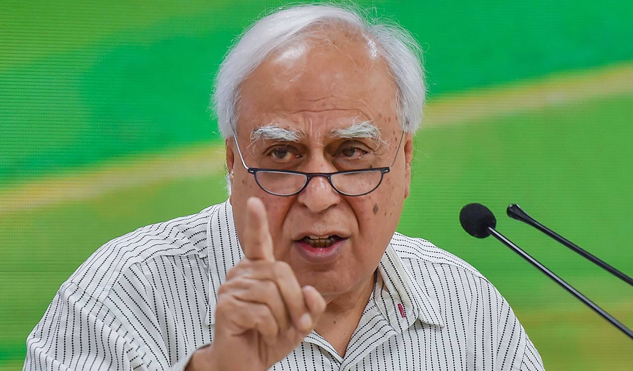 Wise words abroad, silence at home: Sibal slams Bhagwat