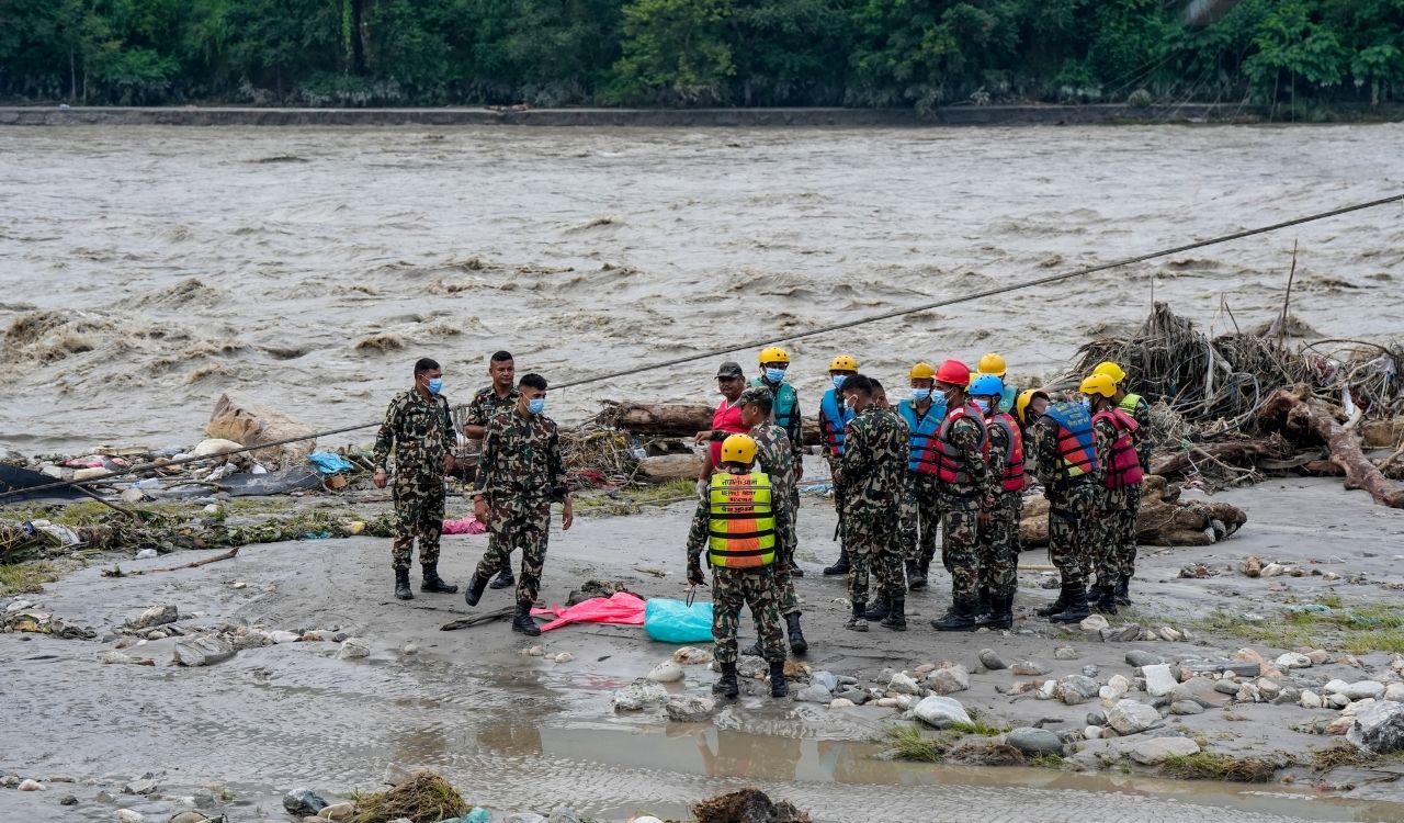 Nepal floods leave trail of devastation as rescuers search for missing