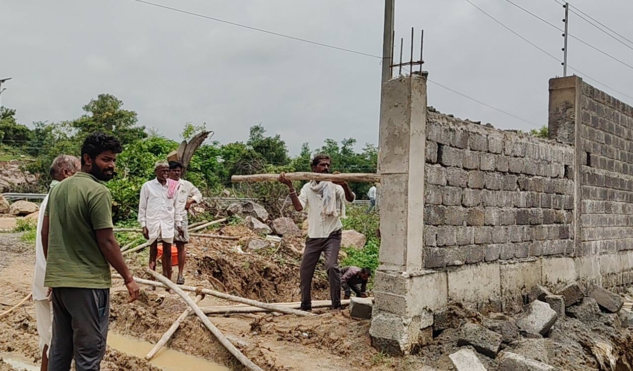 Telangana: Villagers demolished compound wall at the guest house of former Minister